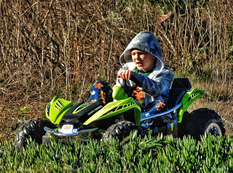 Boy driving an ATV