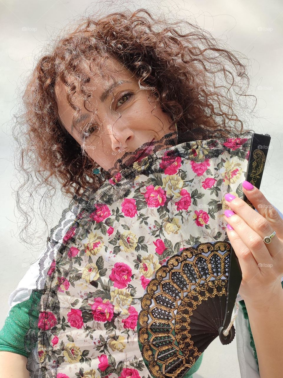 Portrait of a woman brunette with fan