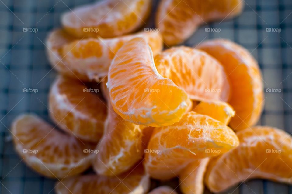 Clementine orange segments on plate