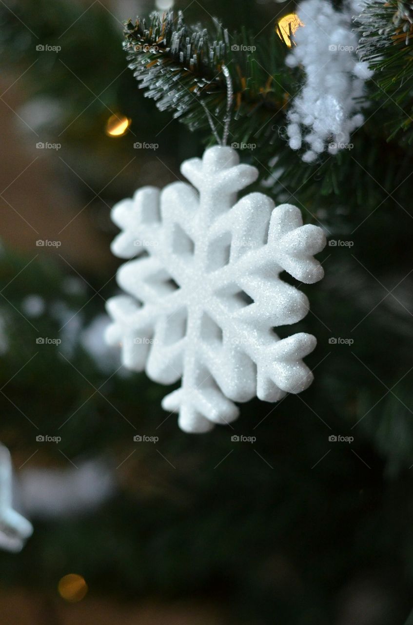 Snowflake hanging on christmas tree