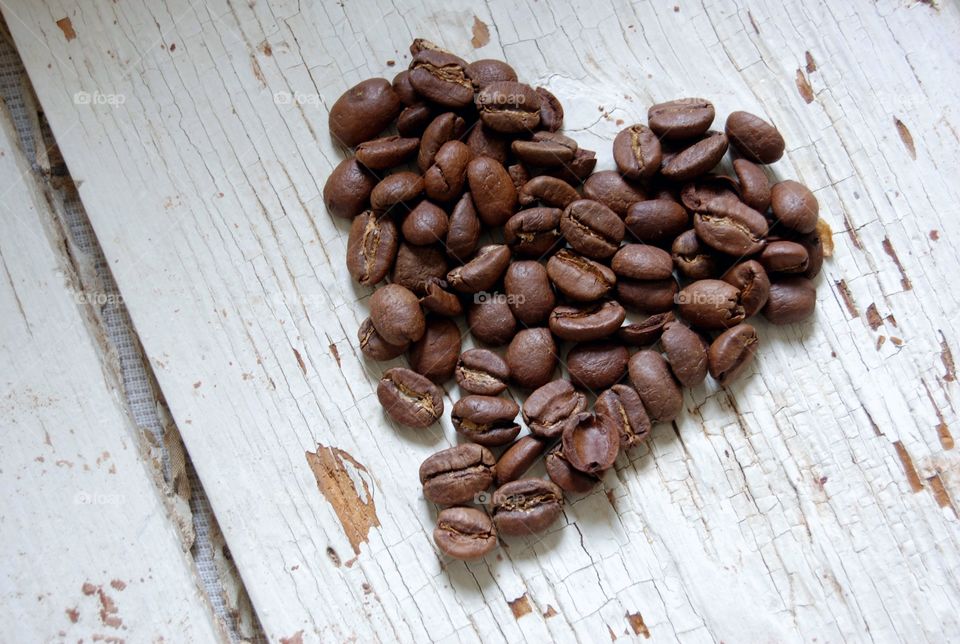High angle view of heart shape made from coffee beans