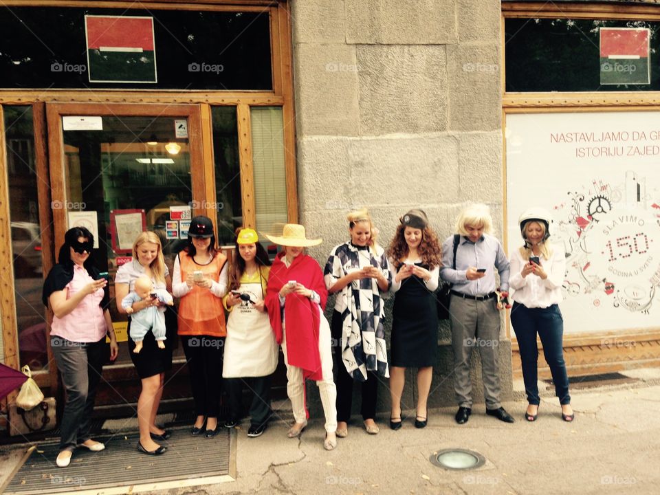 Masked people in front of bank