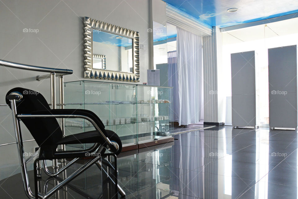 lobby at beauty clinic. chair and products counter at beauty center