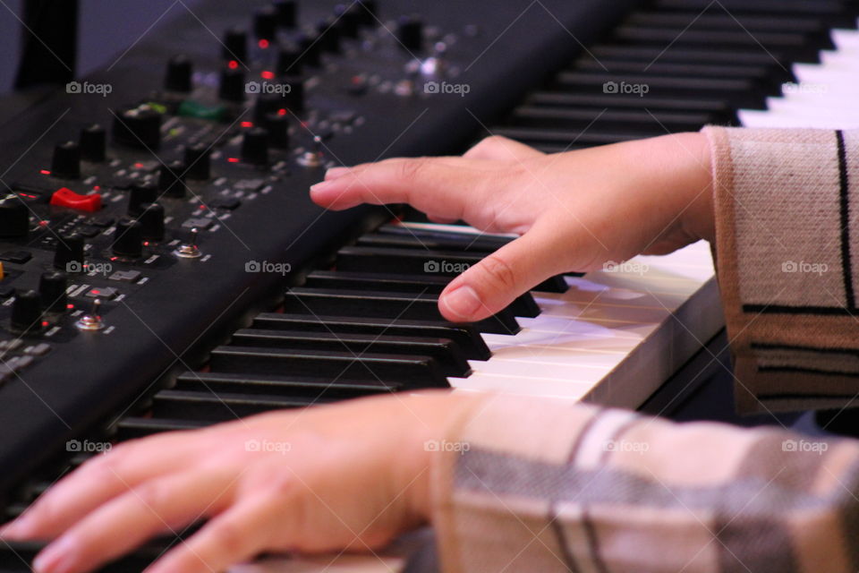 Hands on piano