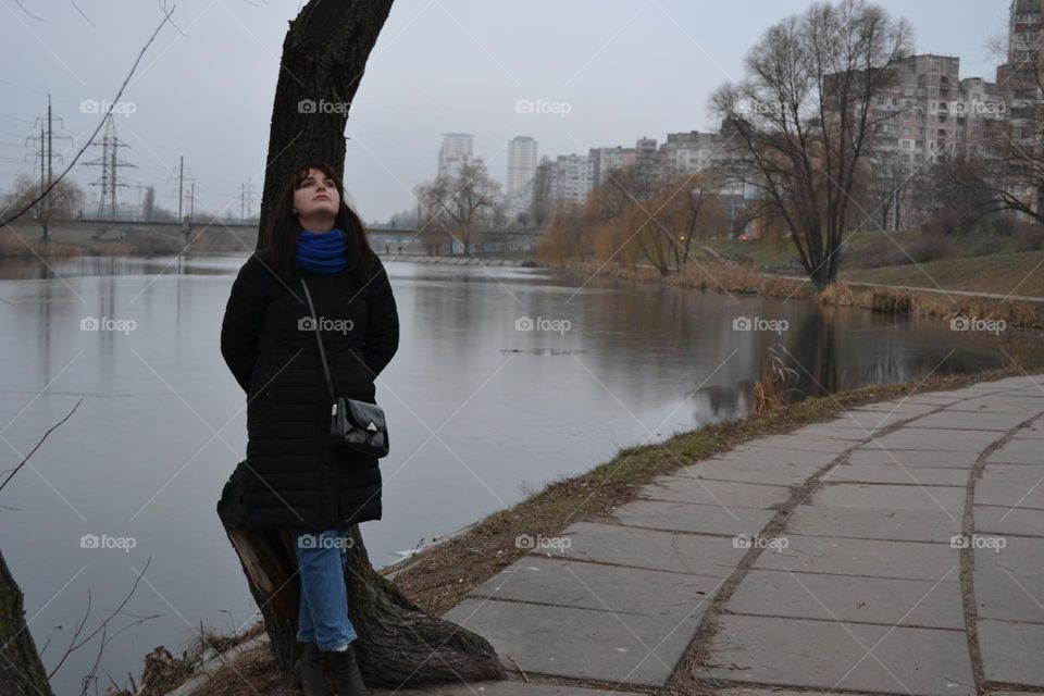 A girl in the middle of a city park