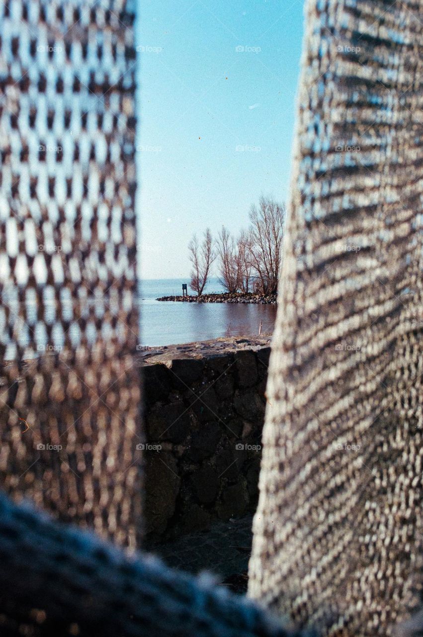 Look through fishnets, at Urk, a beautiful fishing town, The Netherlands 