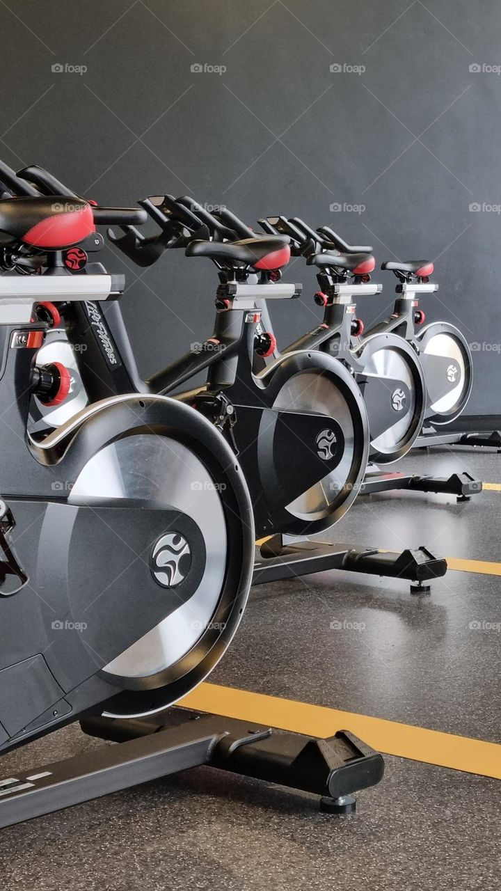 spinning bicycles in a gym studio.