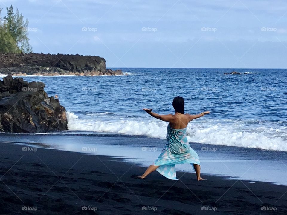 Yoga on the black sand