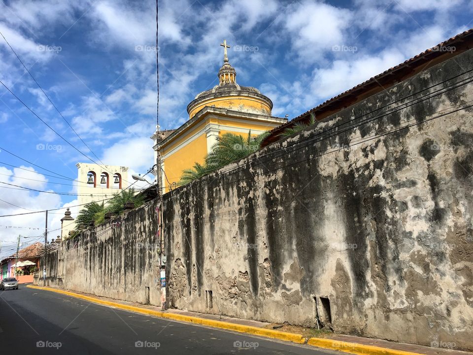 Old wall along street in Granada.