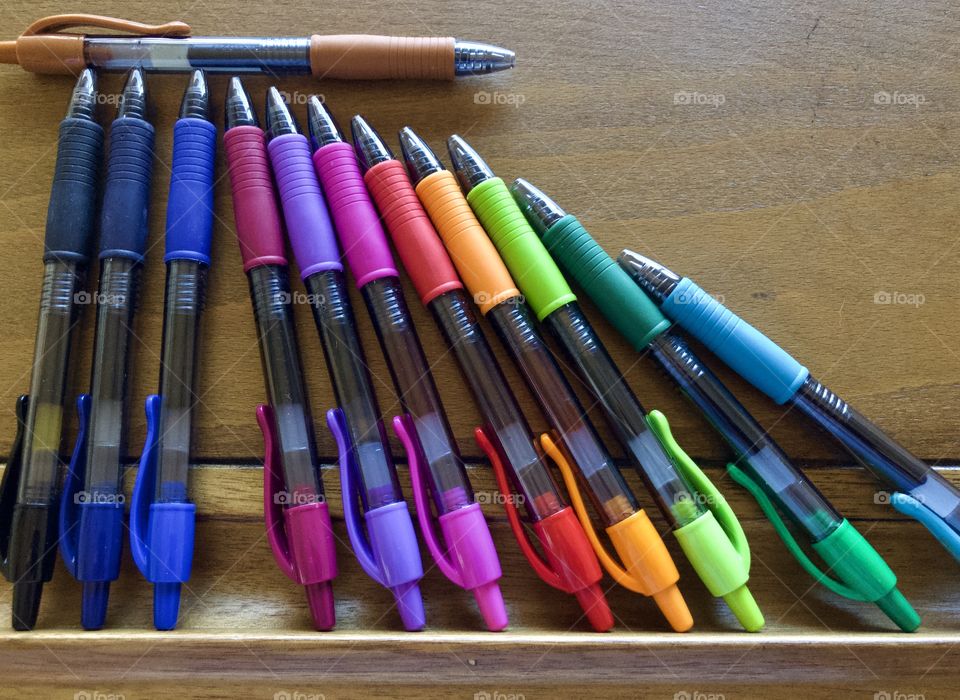 Colorful pens on drafting table 
