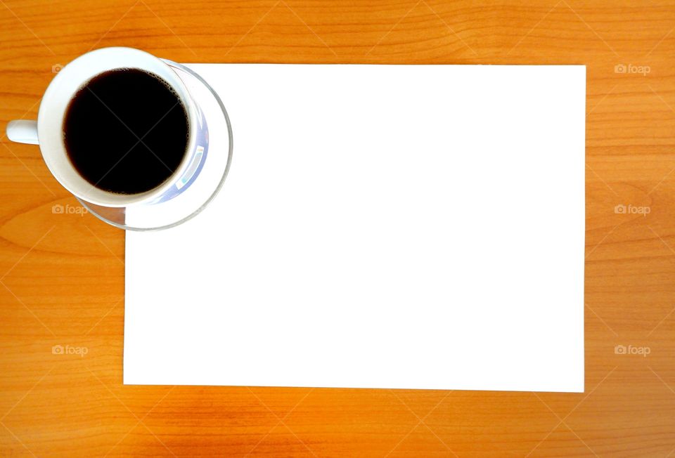 Blank paper with a cup of coffee for your text.
