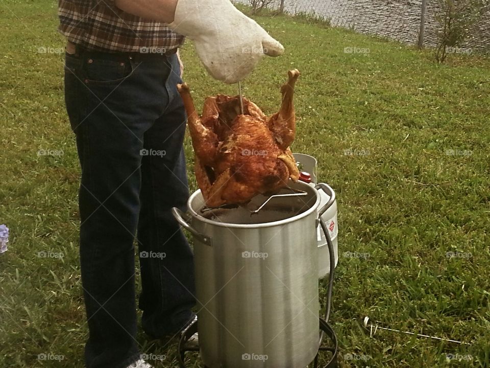 frying a turkey for a Thanksgiving feast