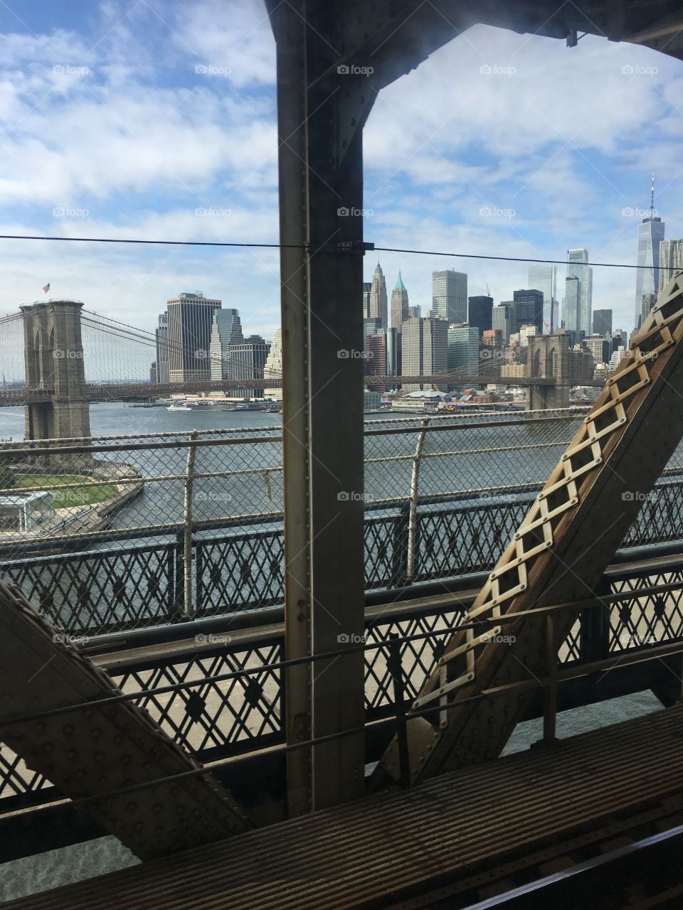 Brooklyn bridge lower Manhattan from train on Manhattan bridge 