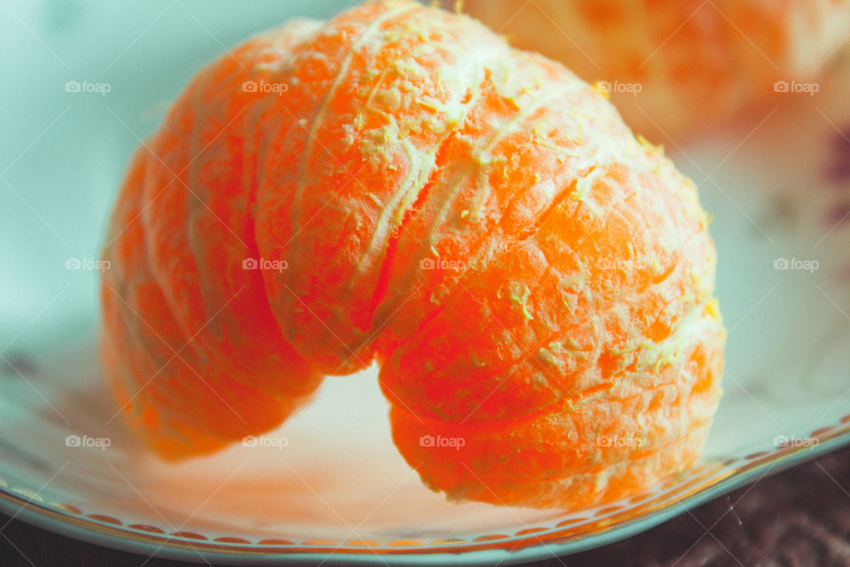 a slice of mandarin on a plate