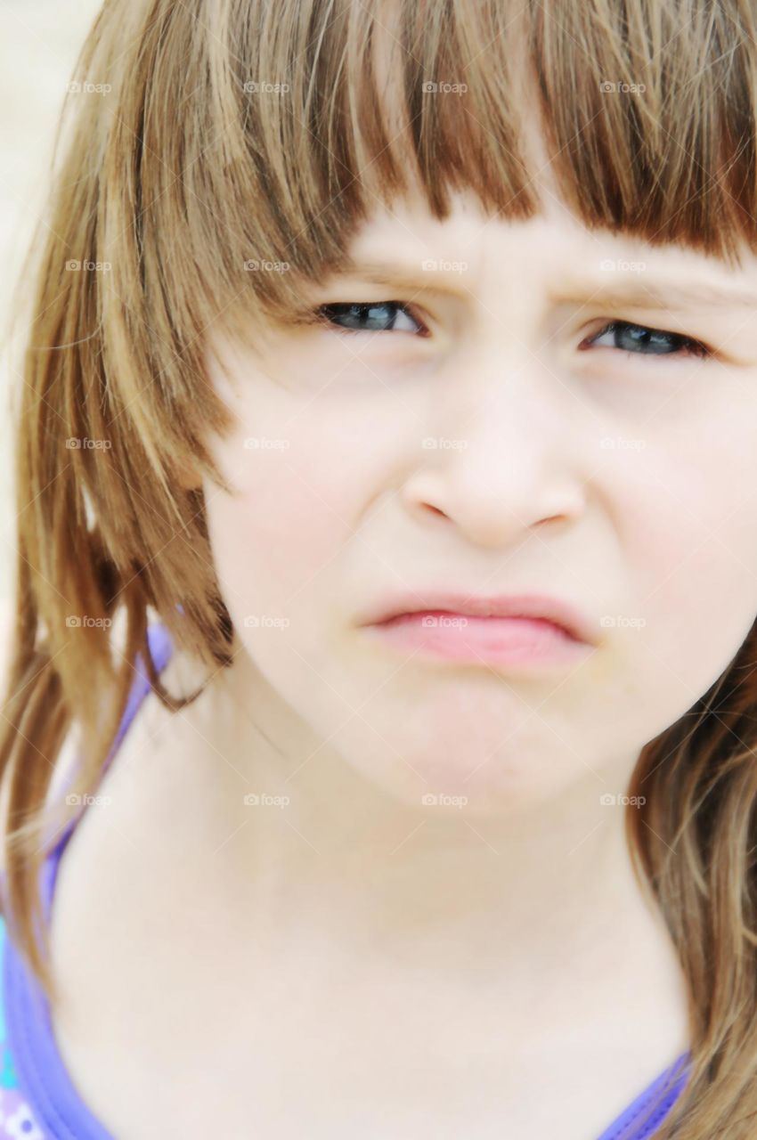 Cute Little girl, facial expression of disgust