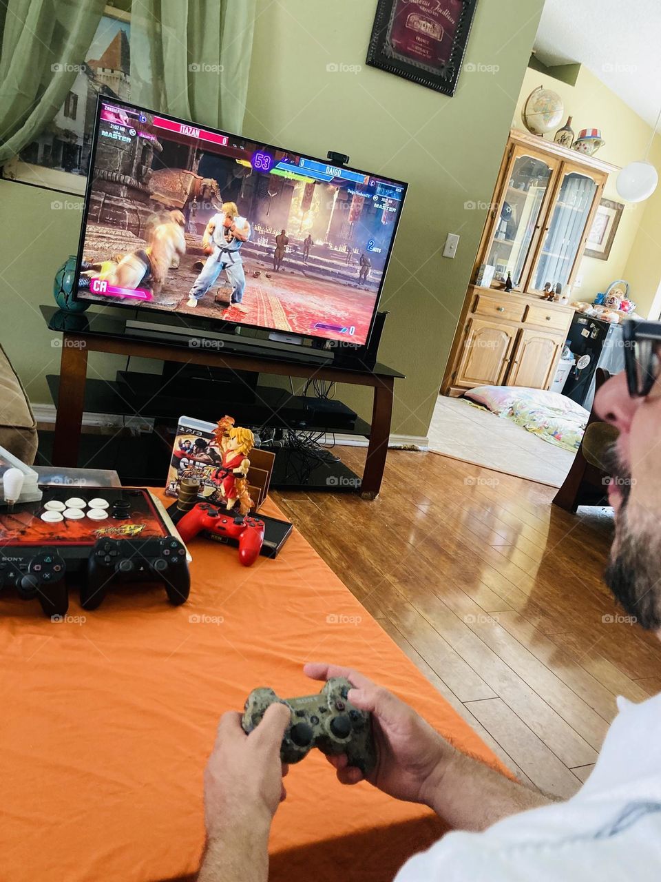 Man playing street fighter video game photography mission 