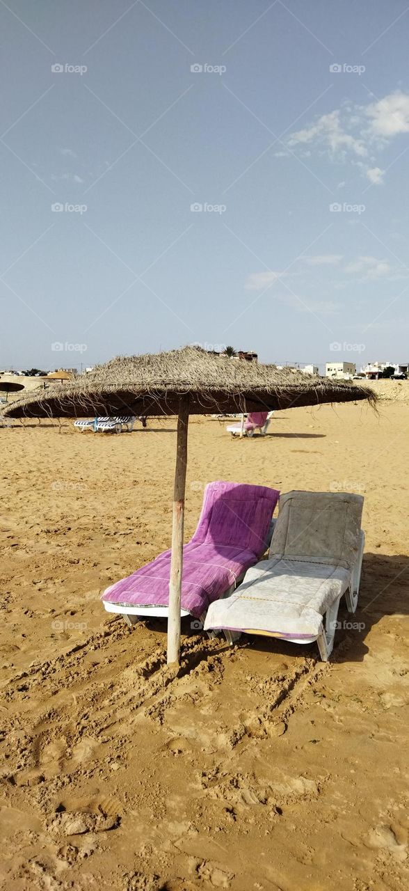 Beautiful seats near the beach in summer vacation.