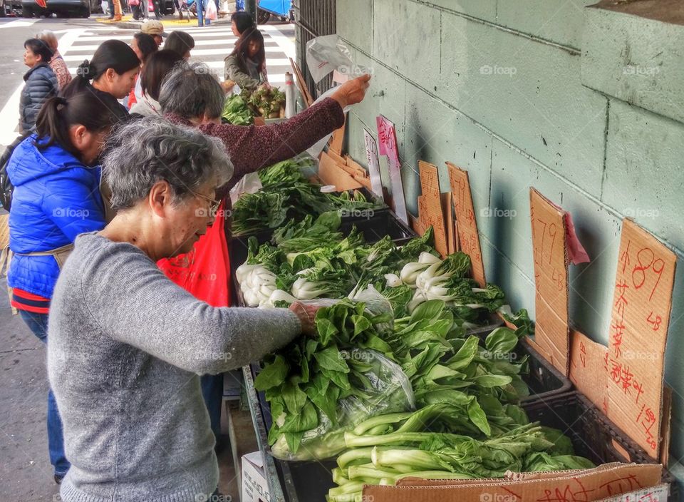 Shopping For Vegetables In A Chinese Street Market. Women Shopping In A Chinese Street Market
