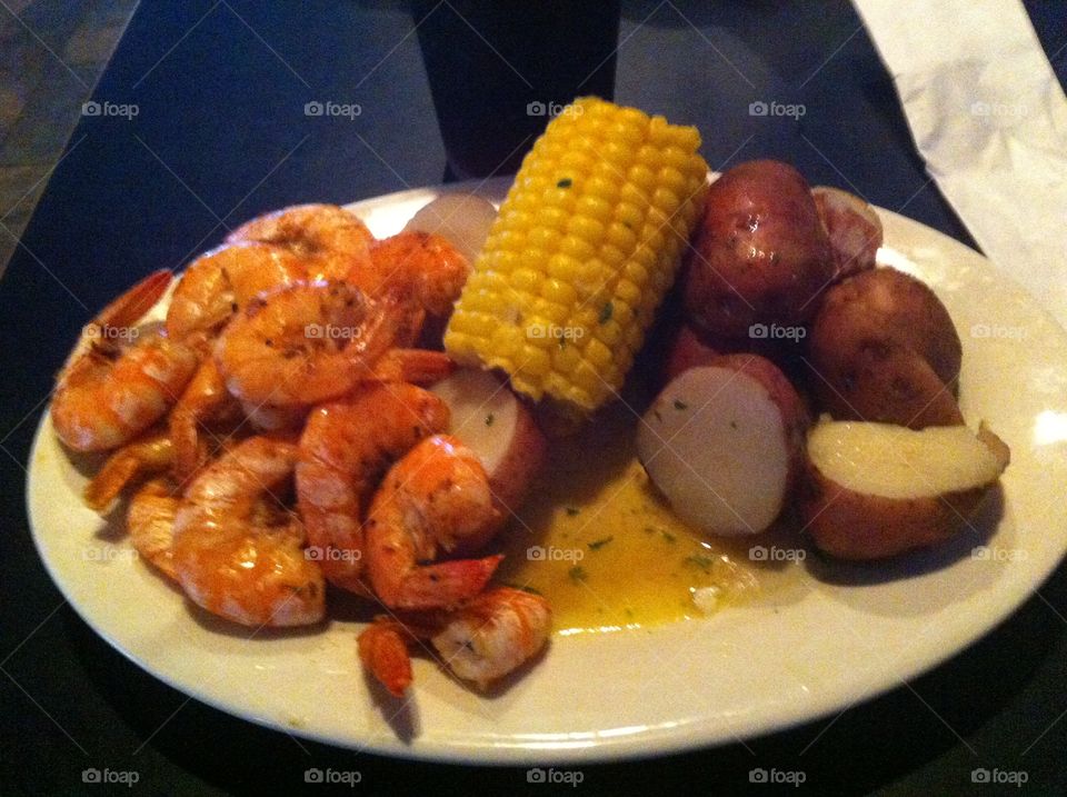 Boiled shrimp, corn and potatoes 