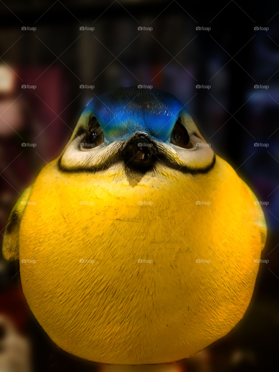 A souvenir with humor.  Fat yellow bird with menacing eyes