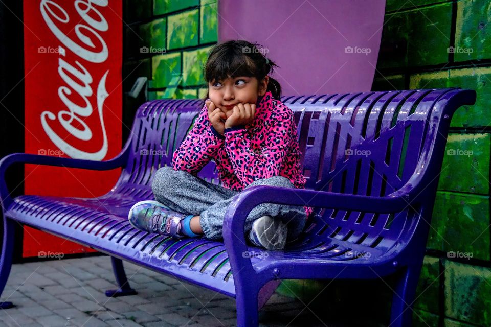 Cute girl on a bench