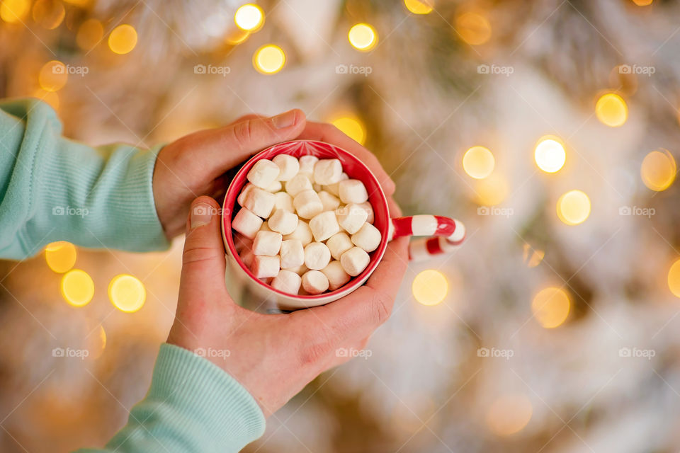 cup of coffee in a cozy festive Christmas atmosphere