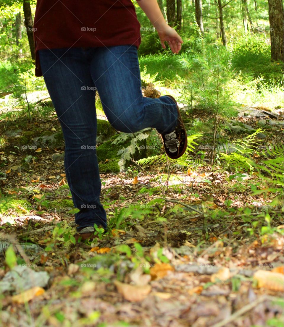 Acorn Forest Mule/Owl: Woman in fall attire dancing in the woods with leaves 