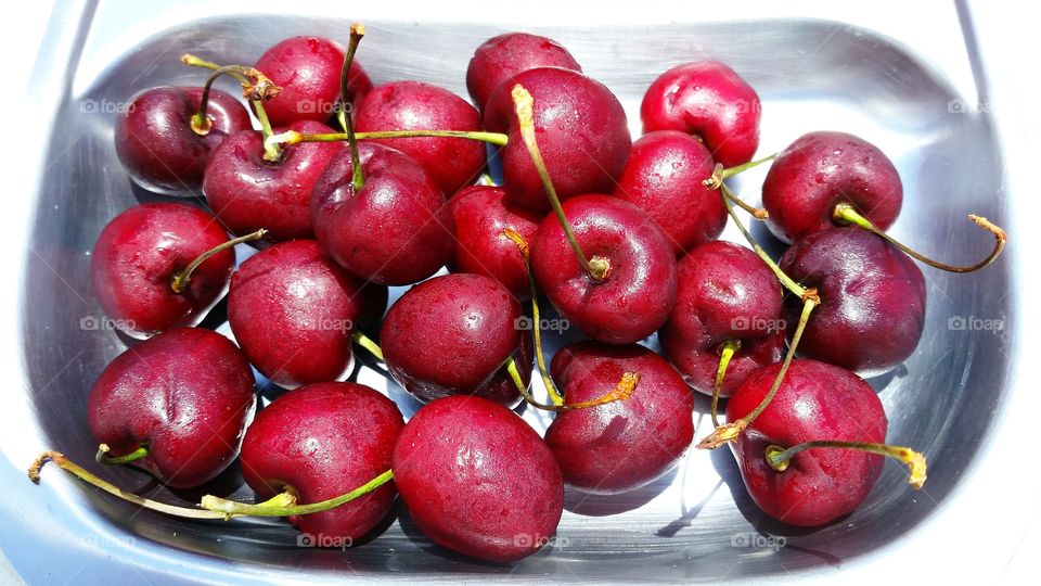 cherries on pewter tray. red cherries on silver serving tray
