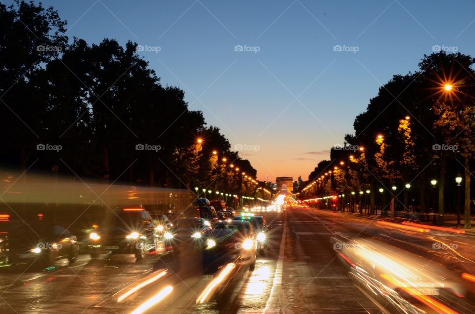 Traffic flying around the Arc de Triumph in Paris