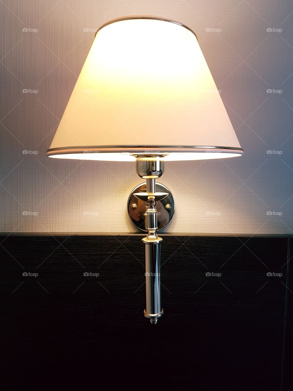 Modern design element of wall lamp. Light and shadow
