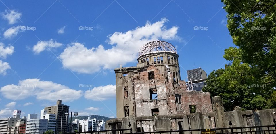 It is the Hiroshima Peace Memorial (Genbaku Dome). It is the only structure left standing in the area where the first atomic bomb exploded on 6 August 1945.