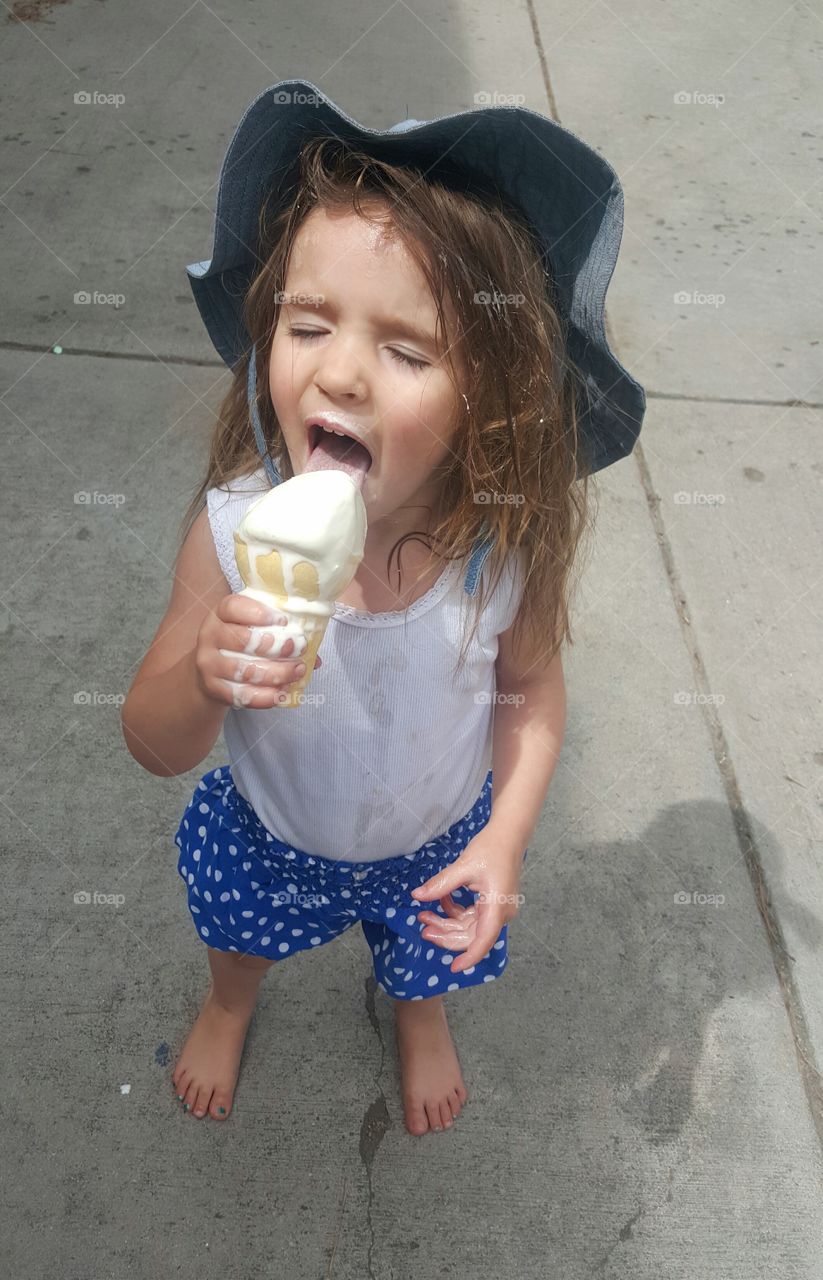 Little girl eating ice cream