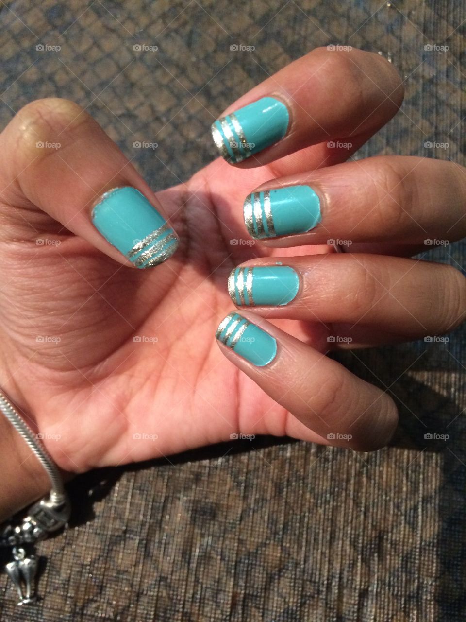 A sea green with a touch of gold 