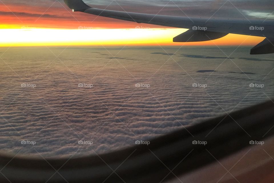Sunrise through a plane window