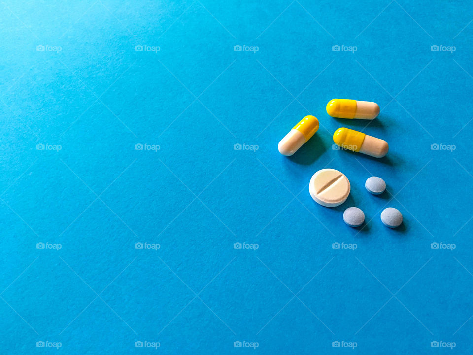 pills on blue background