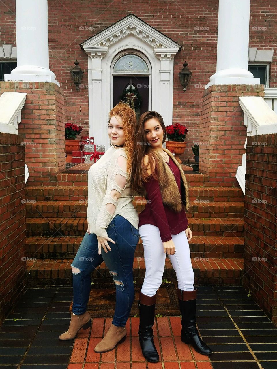 pretty girls posing in front of steps