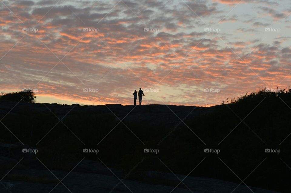 Togetherness.. When I was on my vacation, I look up on the  Mountain, and I see this loving couple in the sunset.