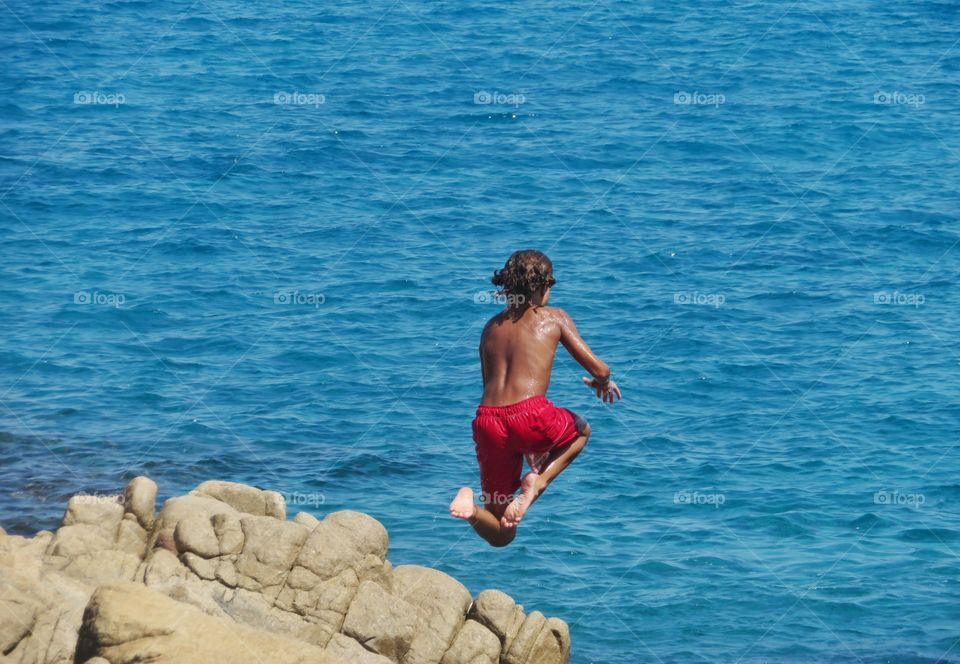 jumping in the blue sea