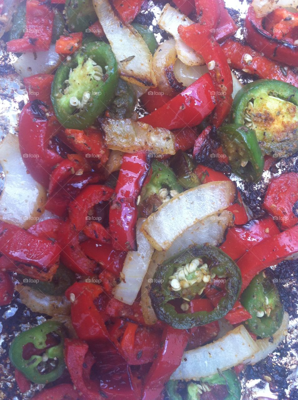 Grilled peppers and onions. Jalapeño peppers, red bell pepper, yellow onion
