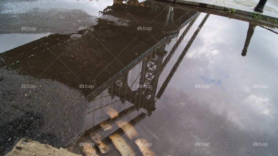 Brooklyn Bridge in a rain puddle