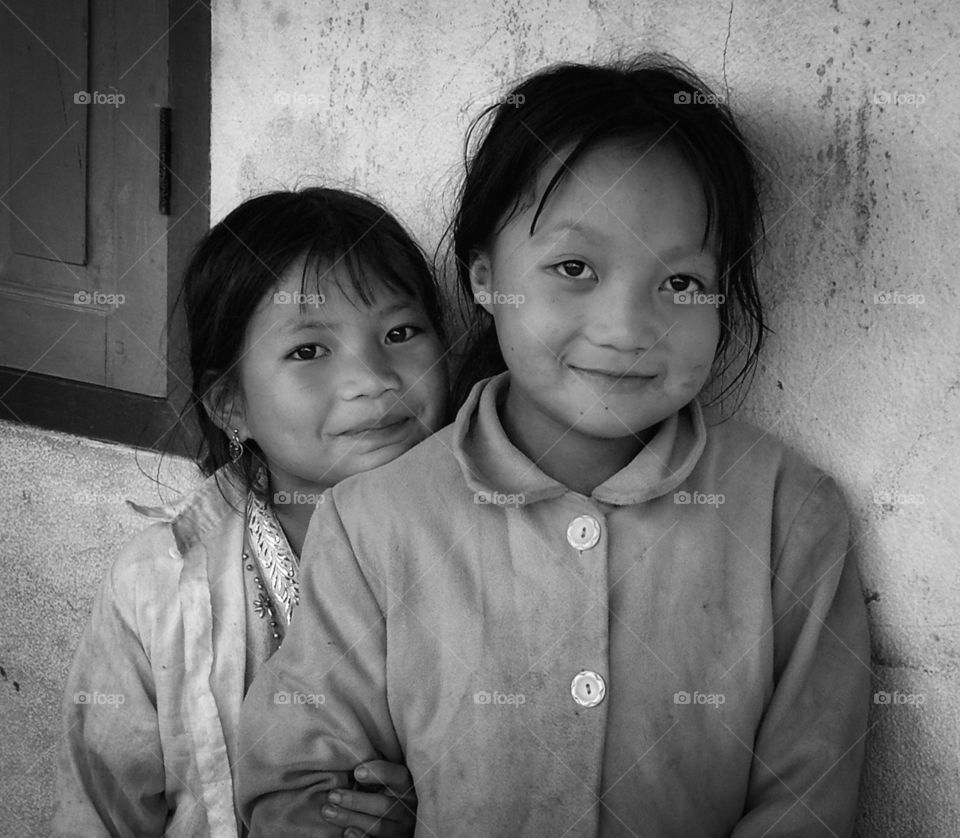 Innocent Laos student’s smiling and hers eyes show happiness when was taken photo