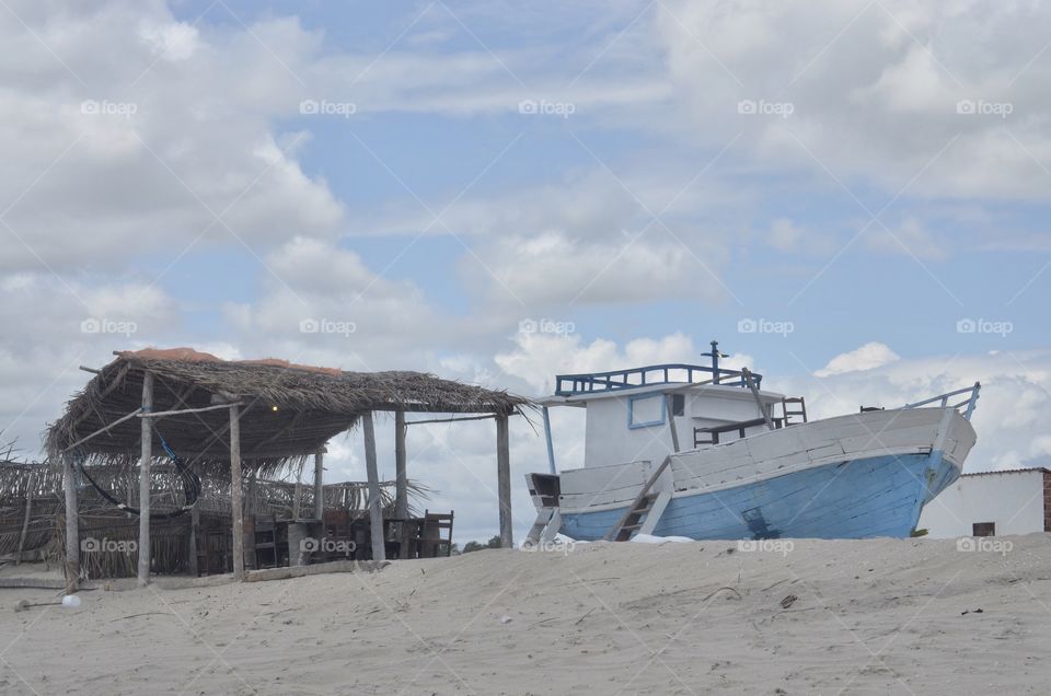 Blue boat in the beach. 