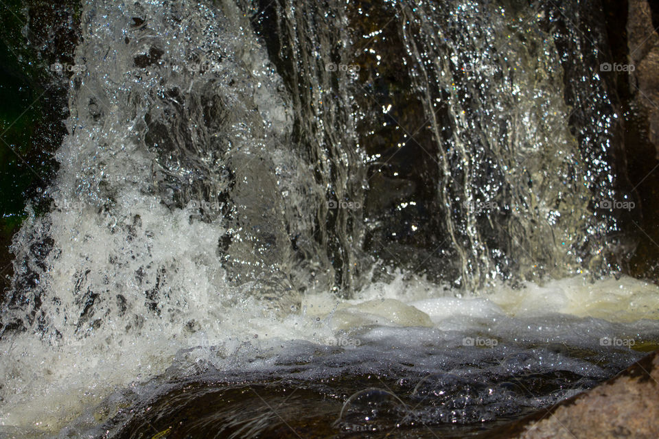 turbulent waterfall in natural river