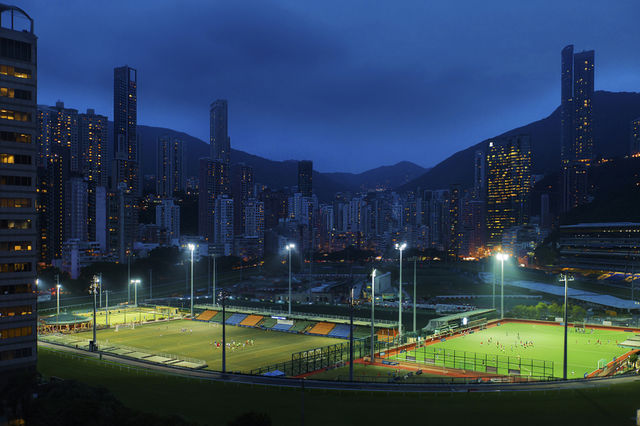 Happy Valley, Hong Kong . At night, with sport grounds lit up 