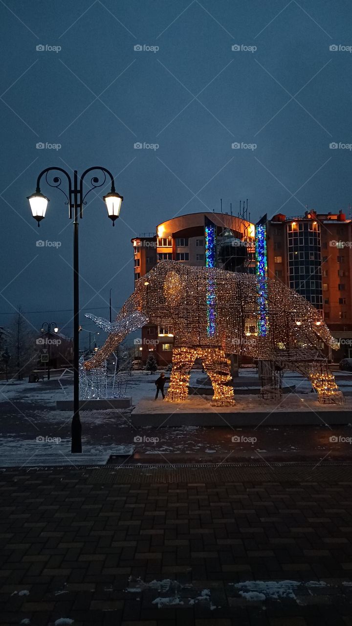 A glowing mammoth on the street of the northern city.