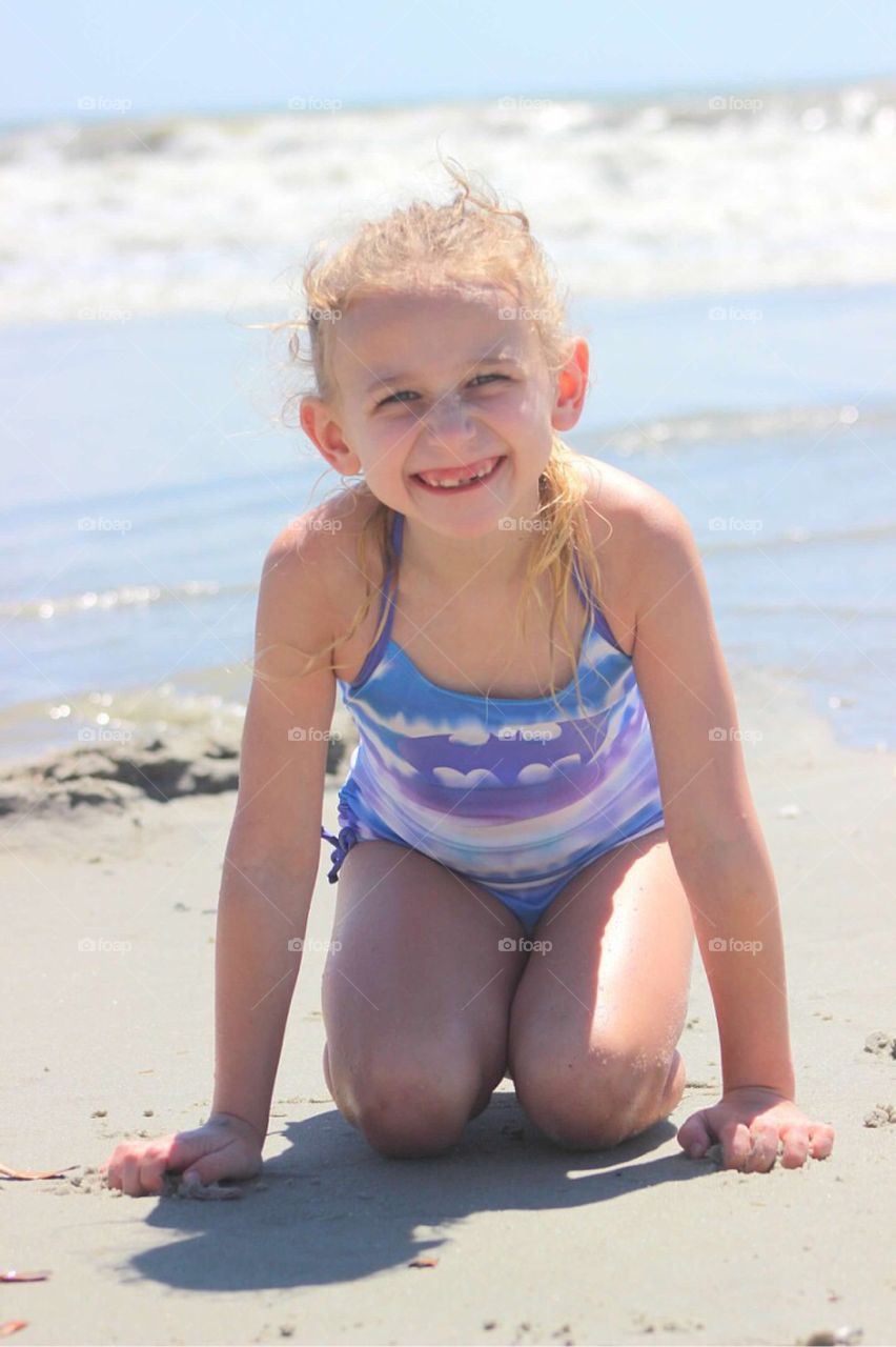 Smiling girl enjoying at beach