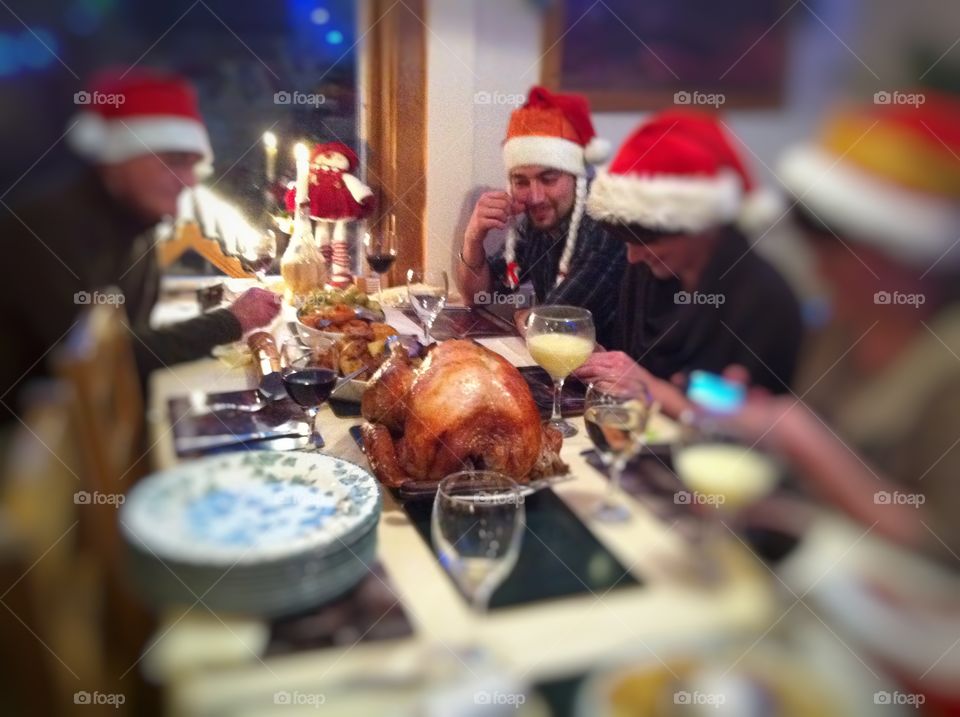 Group of friends with santa hat in dinner party