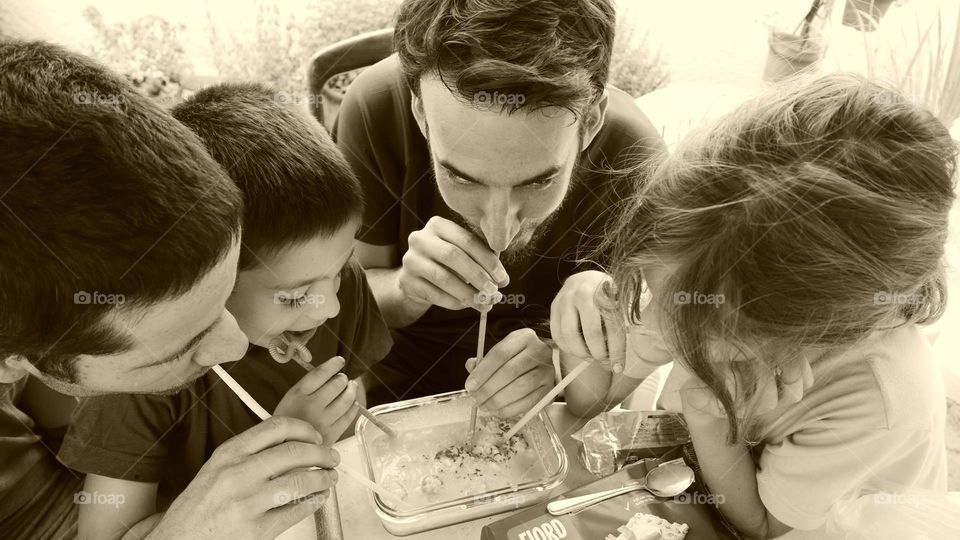 Drinking together with straws melted ice cream  