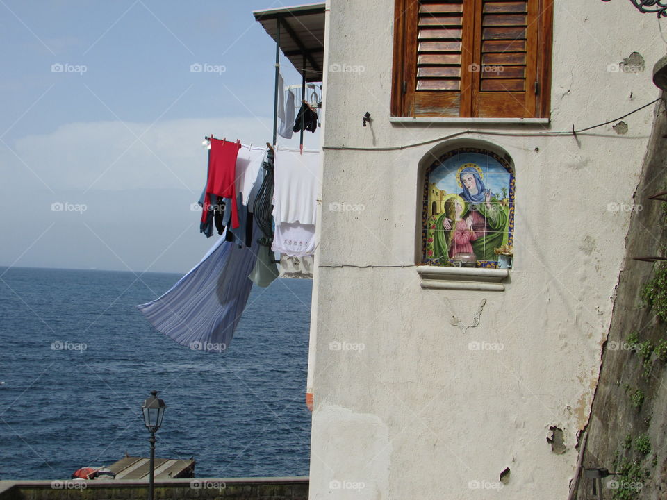 Clothes hung out with the scent of salt air in Sorrento