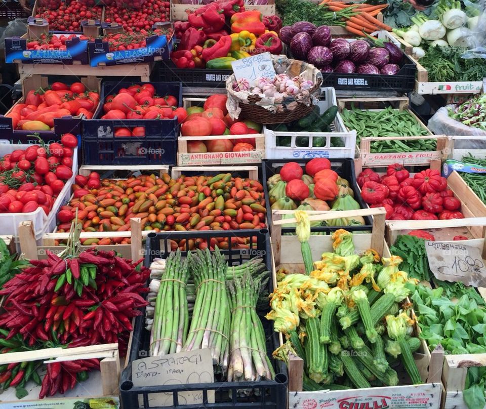 Farmer's market in Rome with colorful vegetable stand
